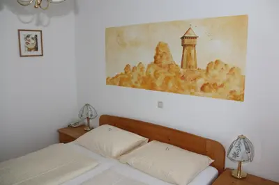 Ein Bett oder Betten in einem Zimmer der Unterkunft Hotel & Hostel Sandwirt
