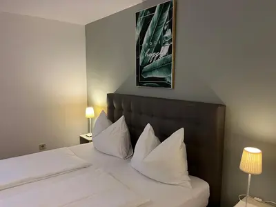 Ein Bett oder Betten in einem Zimmer der Unterkunft Hotel Pension Waldesruh