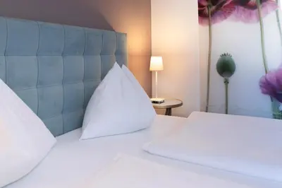 Ein Bett oder Betten in einem Zimmer der Unterkunft Hotel Pension Waldesruh