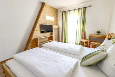 Ein Bett oder Betten in einem Zimmer der Unterkunft Pension Tannhof
