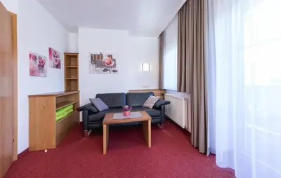Ein Sitzbereich in der Unterkunft Landhaus Rosengartl