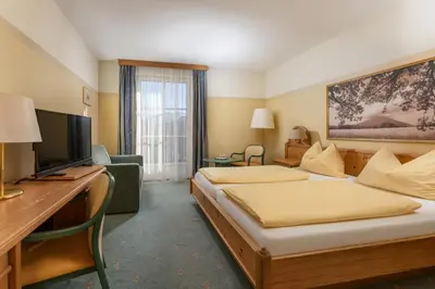Ein Bett oder Betten in einem Zimmer der Unterkunft Hotel Restaurant Lebzelter
