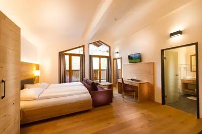 Ein Bett oder Betten in einem Zimmer der Unterkunft Hotel Dorfer