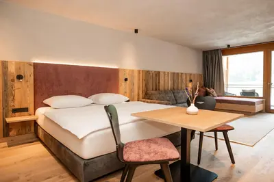 Ein Bett oder Betten in einem Zimmer der Unterkunft Hotel Dorfer
