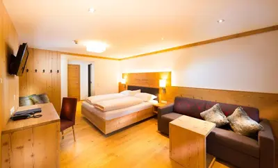 Ein Bett oder Betten in einem Zimmer der Unterkunft Hotel Dorfer