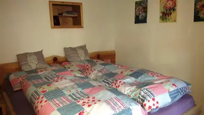 Ein Bett oder Betten in einem Zimmer der Unterkunft Ferienappartement am Leisnitzbach