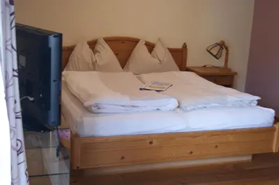 Ein Bett oder Betten in einem Zimmer der Unterkunft Dachstein West Hotel GmbH-Kirchenwirt Russbach