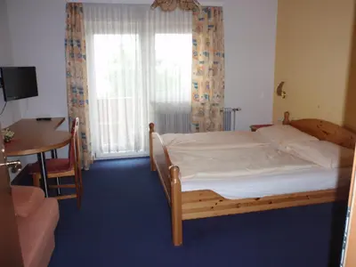 Ein Bett oder Betten in einem Zimmer der Unterkunft Pension ALPENHAUS