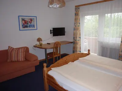 Ein Bett oder Betten in einem Zimmer der Unterkunft Pension ALPENHAUS