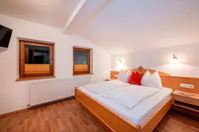 Ein Bett oder Betten in einem Zimmer der Unterkunft Ferienhaus Hubertus - PRECHTLHOF