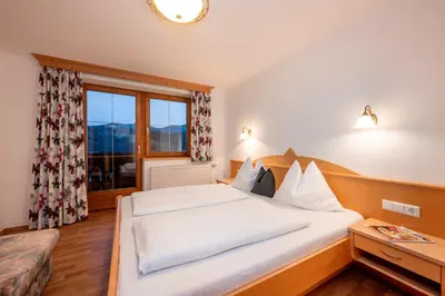 Ein Bett oder Betten in einem Zimmer der Unterkunft Ferienhaus Hubertus - PRECHTLHOF