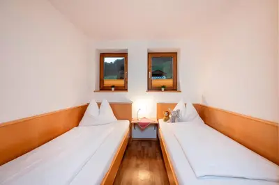 Ein Bett oder Betten in einem Zimmer der Unterkunft Ferienhaus Hubertus - PRECHTLHOF