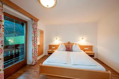Ein Bett oder Betten in einem Zimmer der Unterkunft Ferienhaus Hubertus - PRECHTLHOF