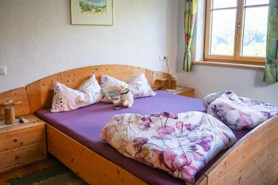 Ein Bett oder Betten in einem Zimmer der Unterkunft Singerskogel - Ferienhof und Jausnstub`n