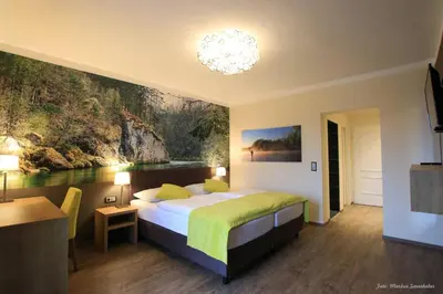 Ein Bett oder Betten in einem Zimmer der Unterkunft Gasthof Alpenblick