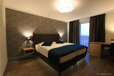 Ein Bett oder Betten in einem Zimmer der Unterkunft Gasthof Alpenblick