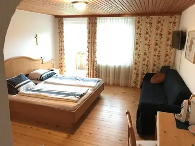 Ein Bett oder Betten in einem Zimmer der Unterkunft Ferienhof am Landsberg