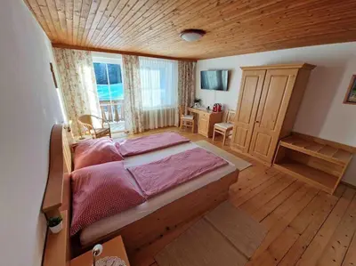 Ein Bett oder Betten in einem Zimmer der Unterkunft Ferienhof am Landsberg