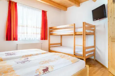 Ein Bett oder Betten in einem Zimmer der Unterkunft Sonnenchalet 1 im Salzburger Lungau