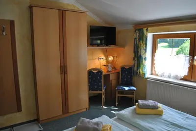Ein Bett oder Betten in einem Zimmer der Unterkunft Gästehaus Eßl