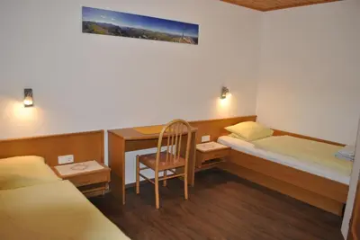 Ein Bett oder Betten in einem Zimmer der Unterkunft Gästehaus Eßl