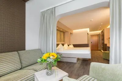 Ein Bett oder Betten in einem Zimmer der Unterkunft Bliem's Familienhotel
