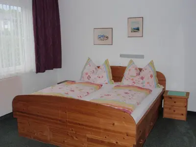 Ein Bett oder Betten in einem Zimmer der Unterkunft Ferienwohnungen Kern