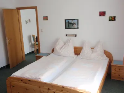 Ein Bett oder Betten in einem Zimmer der Unterkunft Ferienwohnungen Kern