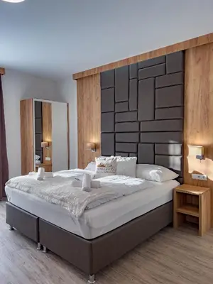 Ein Bett oder Betten in einem Zimmer der Unterkunft Sylpaulerhof Aparthotel