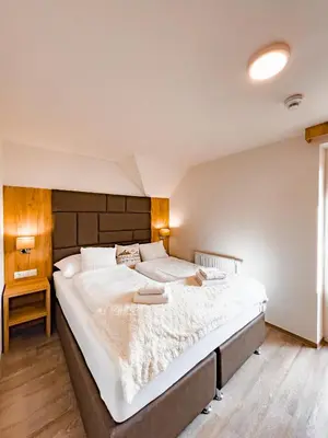 Ein Bett oder Betten in einem Zimmer der Unterkunft Sylpaulerhof Aparthotel