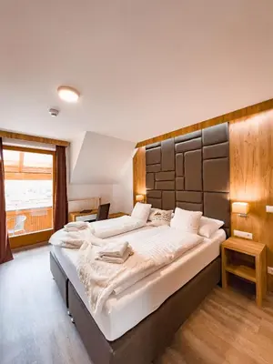 Ein Bett oder Betten in einem Zimmer der Unterkunft Sylpaulerhof Aparthotel