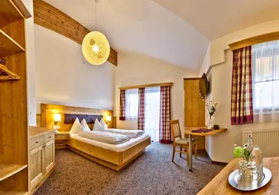 Ein Bett oder Betten in einem Zimmer der Unterkunft Salzburgerhof Flachau