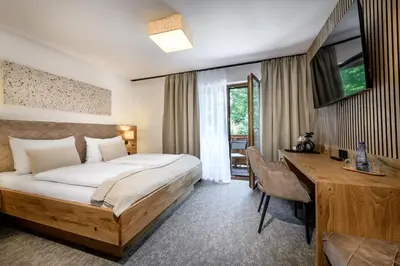 Ein Bett oder Betten in einem Zimmer der Unterkunft Salzburgerhof Flachau