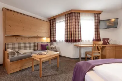 Ein Bett oder Betten in einem Zimmer der Unterkunft Salzburgerhof Flachau