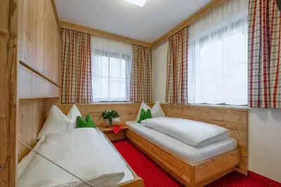 Ein Bett oder Betten in einem Zimmer der Unterkunft Pension Haus am Dorfplatz