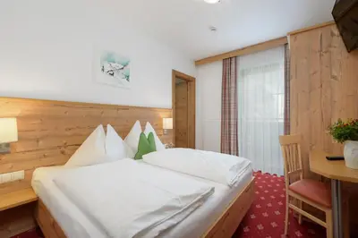 Ein Bett oder Betten in einem Zimmer der Unterkunft Pension Haus am Dorfplatz
