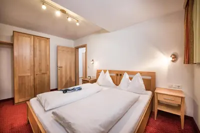 Ein Bett oder Betten in einem Zimmer der Unterkunft Appartements Salzburgerhof