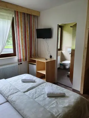 Ein Bett oder Betten in einem Zimmer der Unterkunft Pension INGE