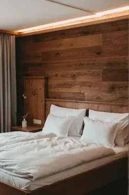 Ein Bett oder Betten in einem Zimmer der Unterkunft Hotel Rosenhof Murau