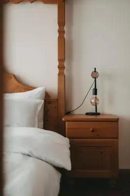 Ein Bett oder Betten in einem Zimmer der Unterkunft Hotel Rosenhof Murau