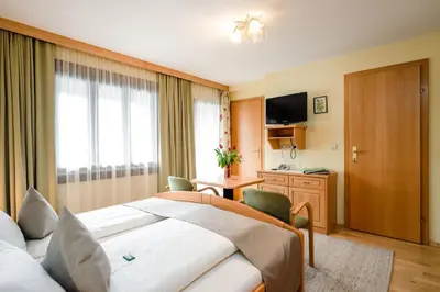 Ein Bett oder Betten in einem Zimmer der Unterkunft Pension Glitschnerhof