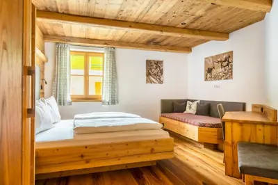 Ein Bett oder Betten in einem Zimmer der Unterkunft Bio-Familienbauernhof Grubsteighof