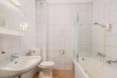Ein Badezimmer in der Unterkunft Ferienhotel Knollhof