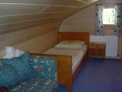 Ein Bett oder Betten in einem Zimmer der Unterkunft Gästehaus Sams