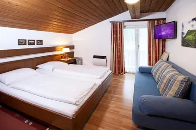 Ein Bett oder Betten in einem Zimmer der Unterkunft Gästehaus Sunkler