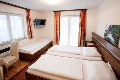 Ein Bett oder Betten in einem Zimmer der Unterkunft Gästehaus Sunkler