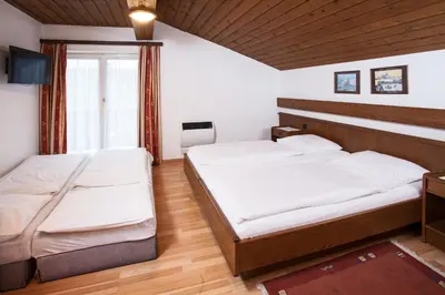 Ein Bett oder Betten in einem Zimmer der Unterkunft Gästehaus Sunkler