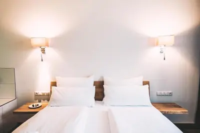 Ein Bett oder Betten in einem Zimmer der Unterkunft Aktivhotel Wildschütz