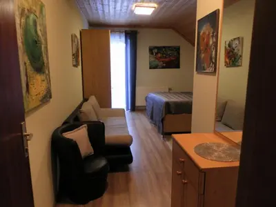 Ein Sitzbereich in der Unterkunft Apartment zum Wasserfall