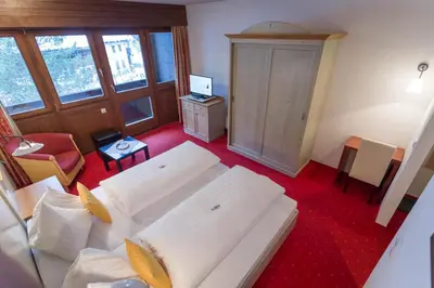 Ein Bett oder Betten in einem Zimmer der Unterkunft Hotel Neuwirt